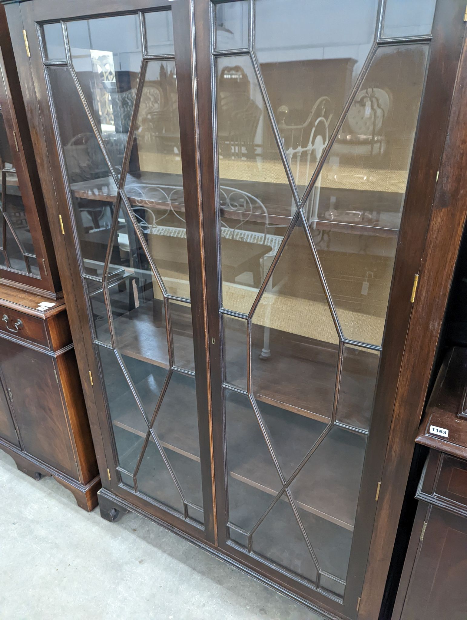 A reproduction George III style glazed mahogany two door display cabinet, width 108cm, depth 40cm, height 172cm